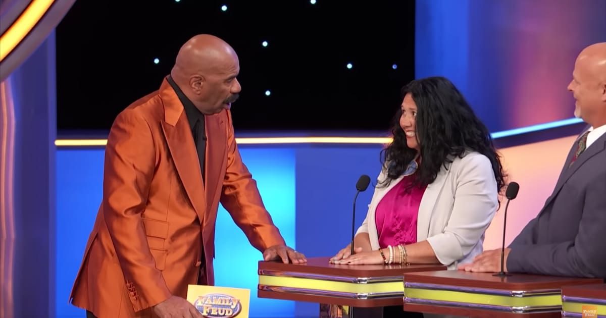 Screenshot showing Steve Harvey and the contestant on "Family Feud." (Cover Image Source: YouTube | Family Feud)
