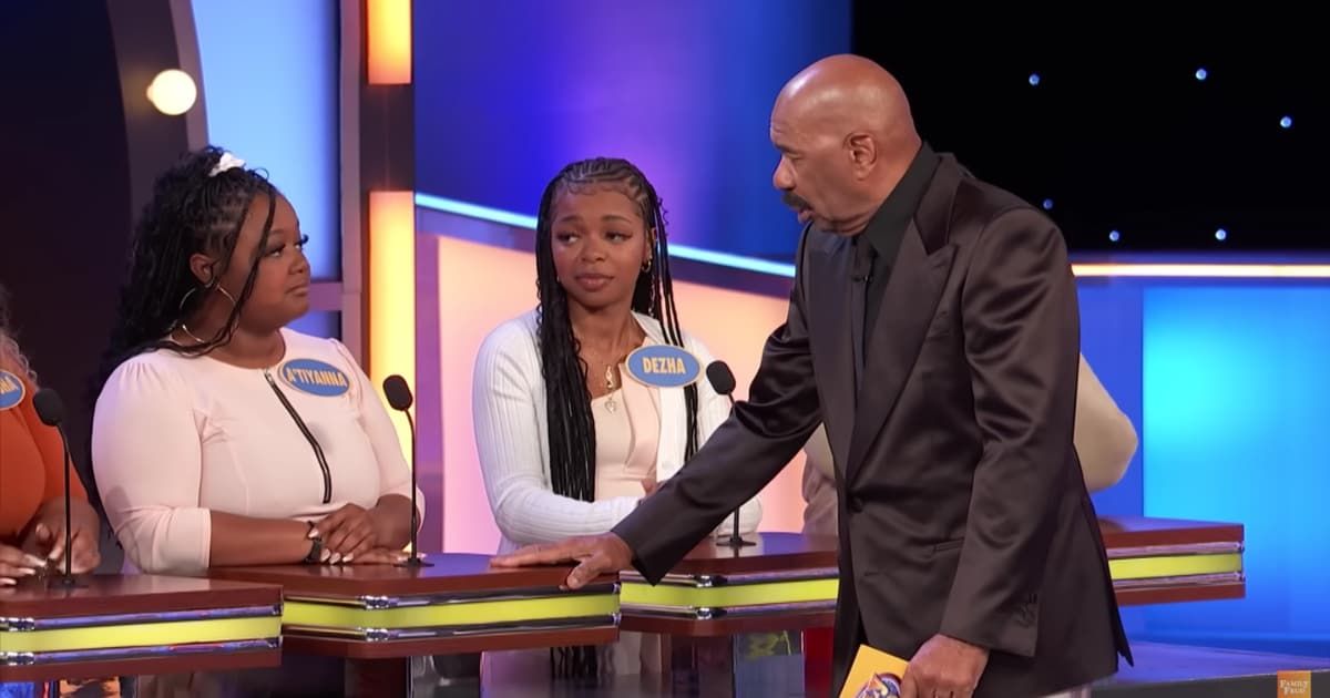 Screenshot showing Steve Harvey with the contestant on "Family Feud." (Cover Image Source: YouTube | Family Feud)