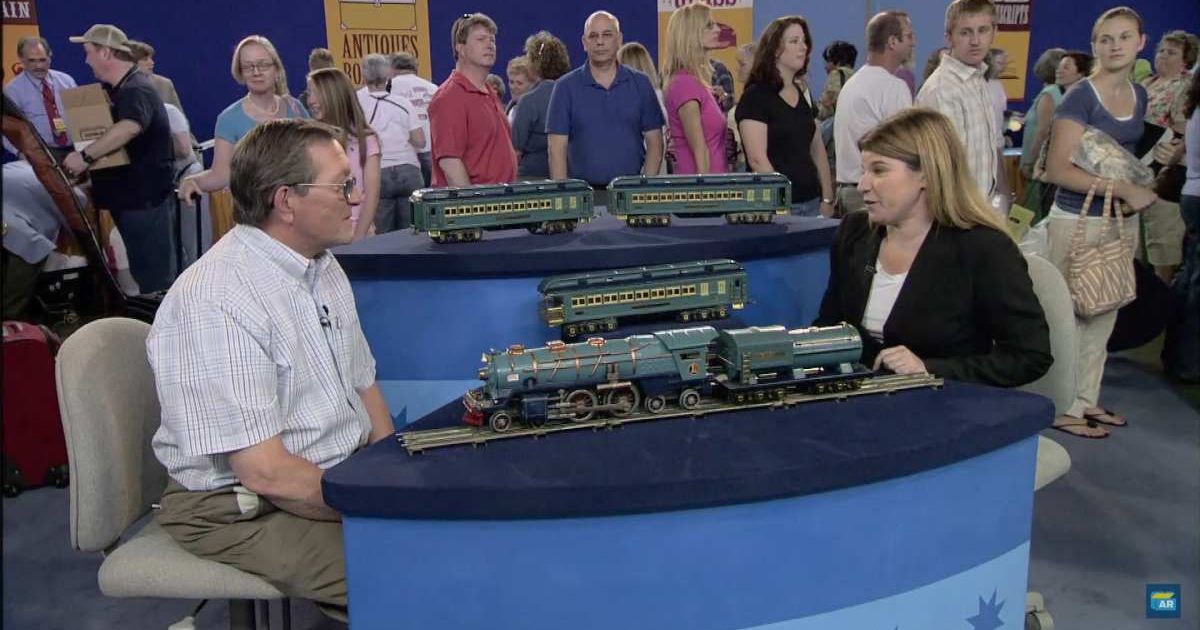 Screenshot showing the guest, the toy train set, and the expert on the show (Cover image source: YouTube/Antiques Roadshow PBS)