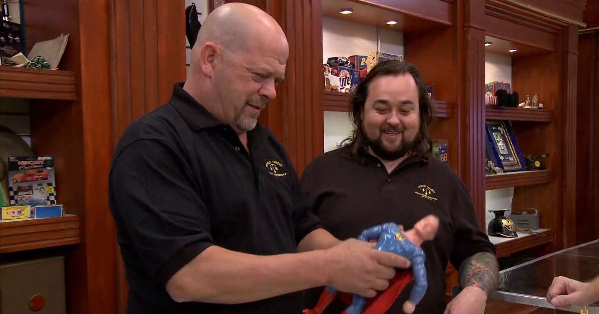 Screenshot showing Rick Harrison and Chumlee looking at the first ever Superman doll (Cover image source: YouTube | Pawn Stars)