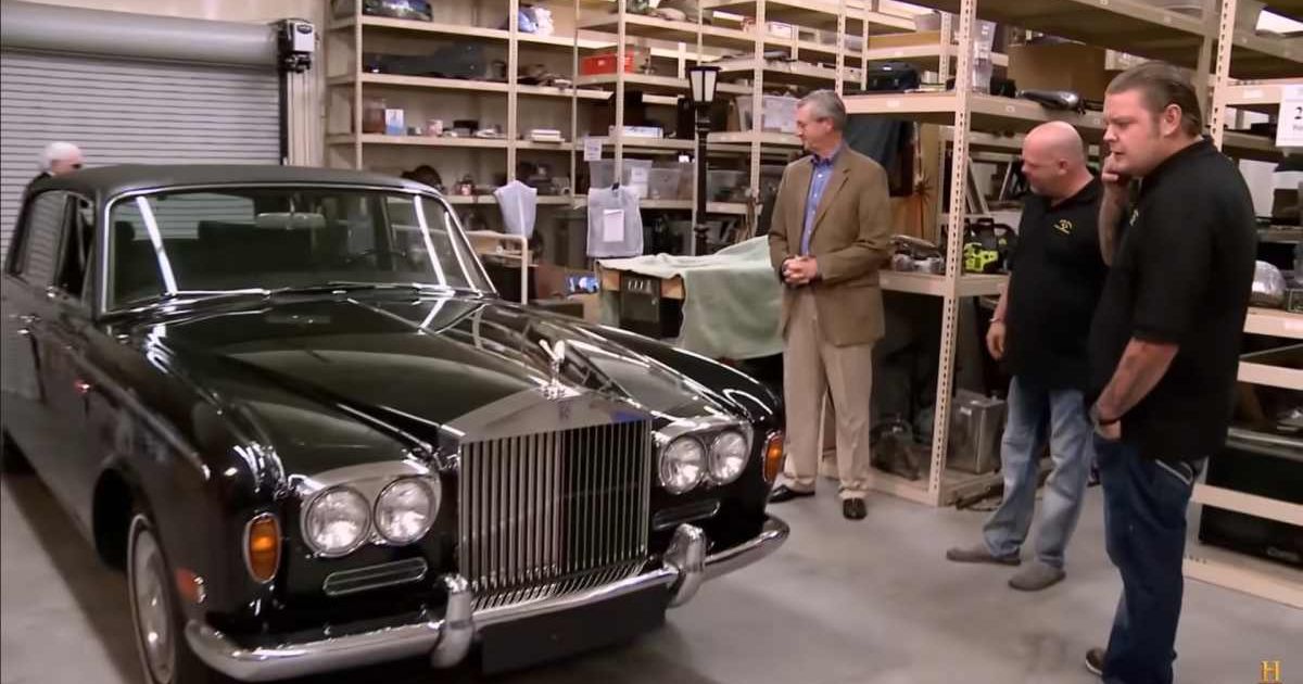 Screenshot showing Rickand Corey Harrison looking at Johnny Cash's Rolls Royce (Cover image source: YouTube/Pawn Stars)