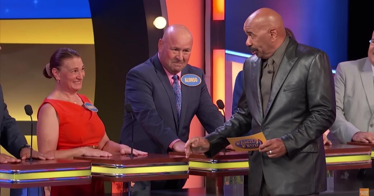 Screenshot showing Steve Harvey with the contestants on "Family Feud" (Cover image source: YouTube | Family Feud)