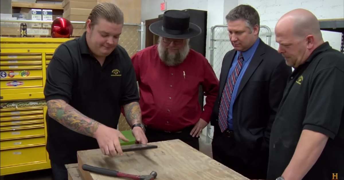 Screenshot showing (from L to R) Corey Harrison, Mark Hall-Patton, the guest, and Rick Harrison on "Pawn Stars" (Cover image source: YouTube | Pawn Stars)
