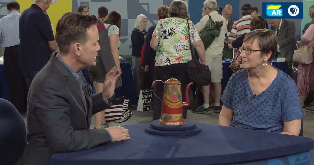 Screenshot showing the expert, the Dutch Tinware Coffee pot, and the guest on the show (Cover image source: YouTube | Antiques Roadshow PBS)