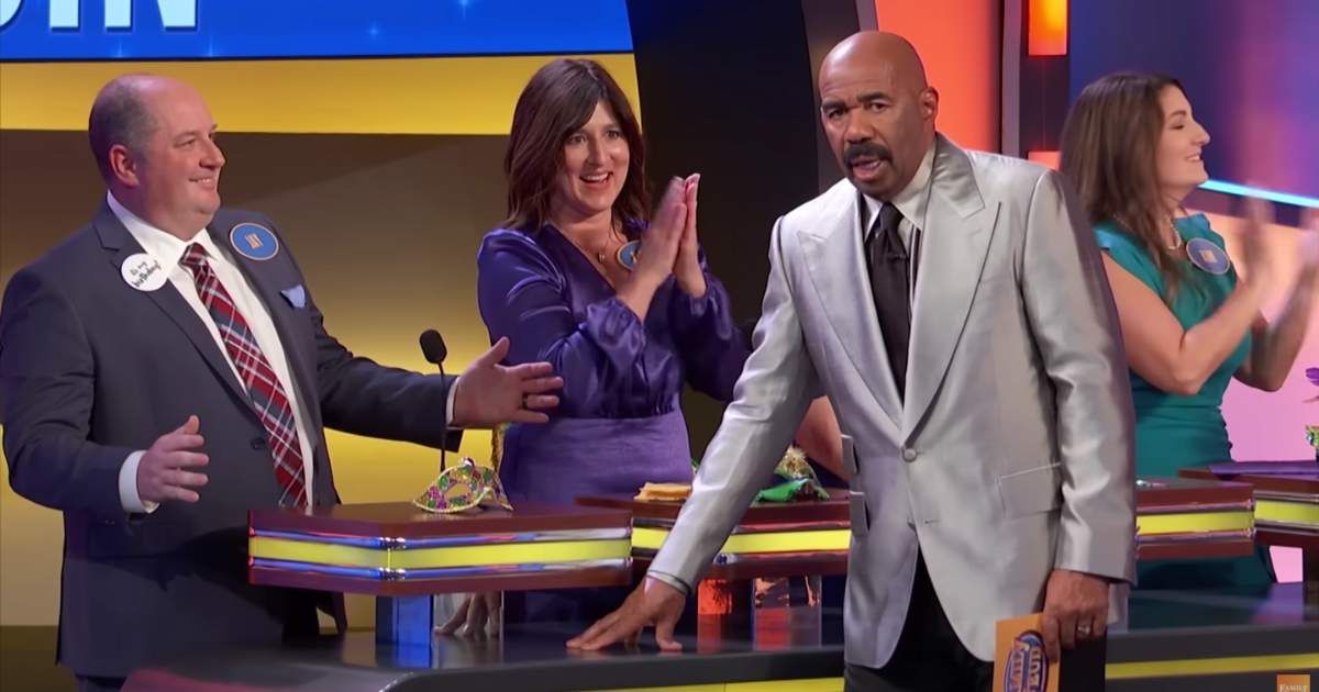 Screenshot showing Steve Harvey with the contestants on "Family Feud." (Cover Image Source: YouTube | Family Feud)