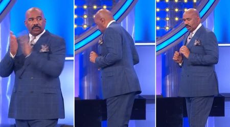 'Family Feud' host Steve Harvey loses his cards on stage while clapping for controversial answer