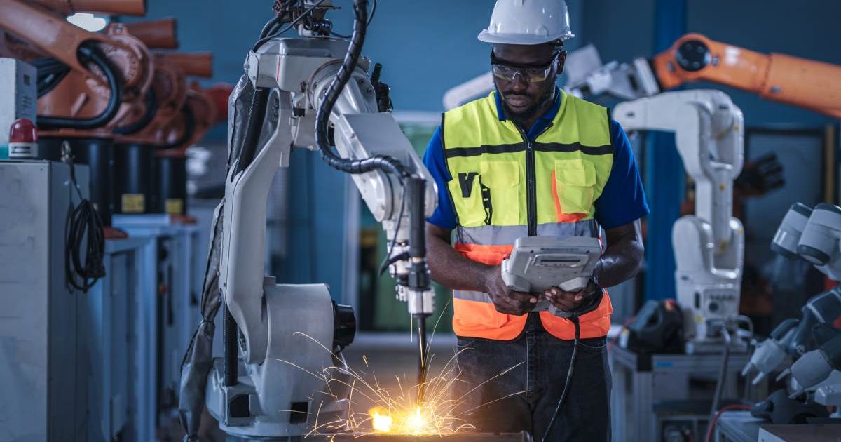 Representative image of engineers controlling a robotic arc (Cover image source: Getty Images/Photo by Vithun Khamsong)