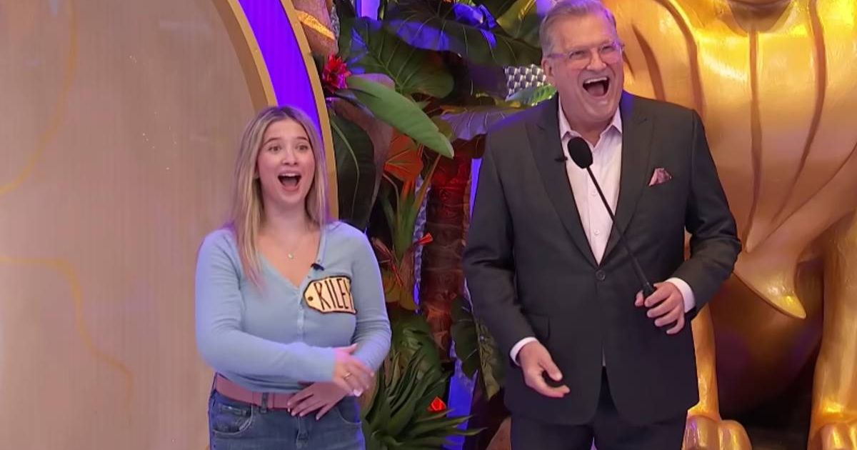 The contestant with host Drew Carey after her massive win (Cover image source: YouTube | Price is Right)