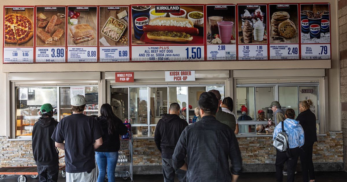 Shoppers queue for food at a Costco Food Court. (Cover Image Source: Getty Images | Photo By Jay L Clendenin)