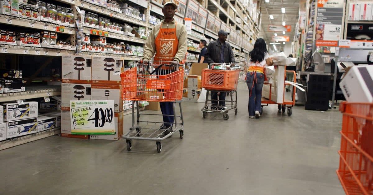 People shop at a Home Depot store (Cover Image Source: Getty Images | Photo by Spencer Platt)
