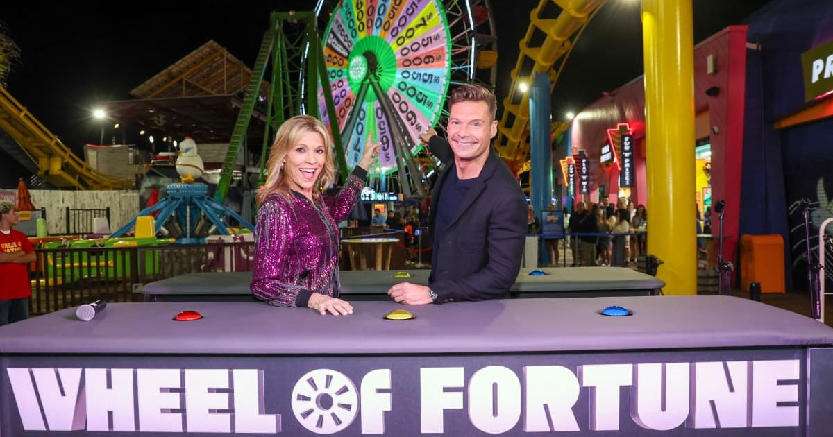 "Wheel Of Fortune" hosts Ryan Seacrest (R) and Vanna White. (Cover image source: Phillip Faraone/Getty Images for CBS Media Ventures / Sony Pictures Television)