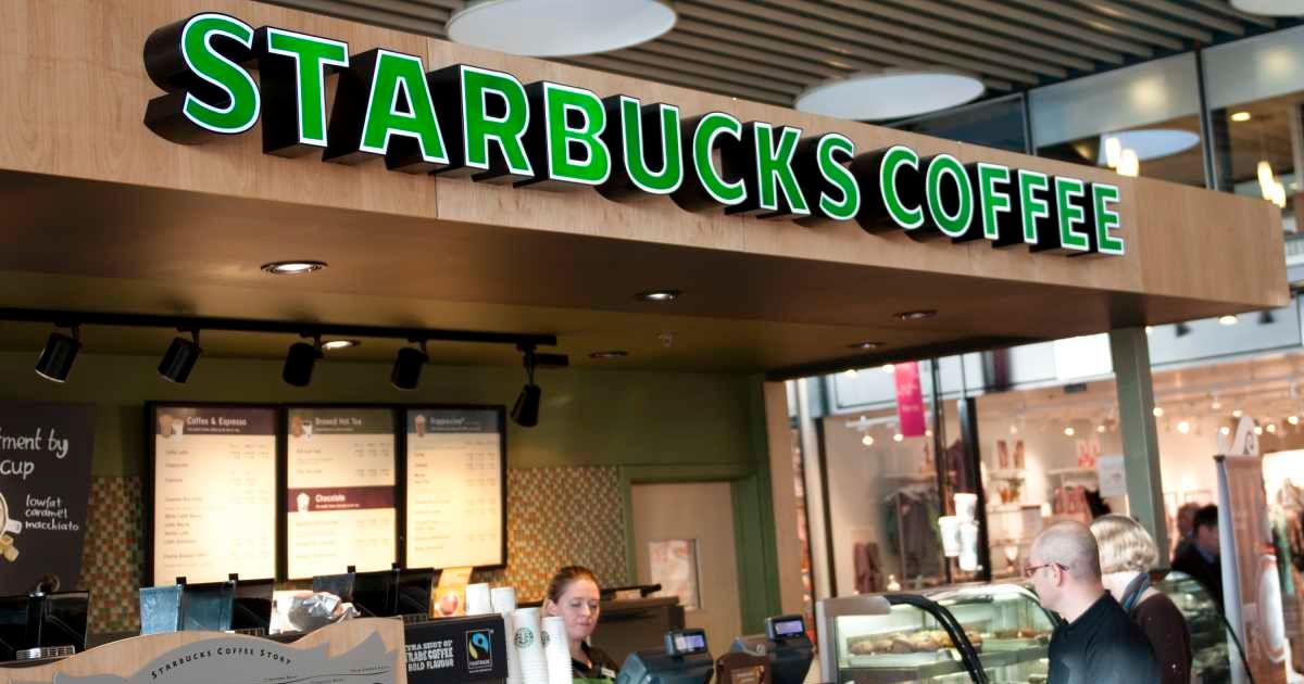 Representational image showing a customer interacting with the staff at Starbucks (Cover image source: Getty Images | mikkelwilliam)