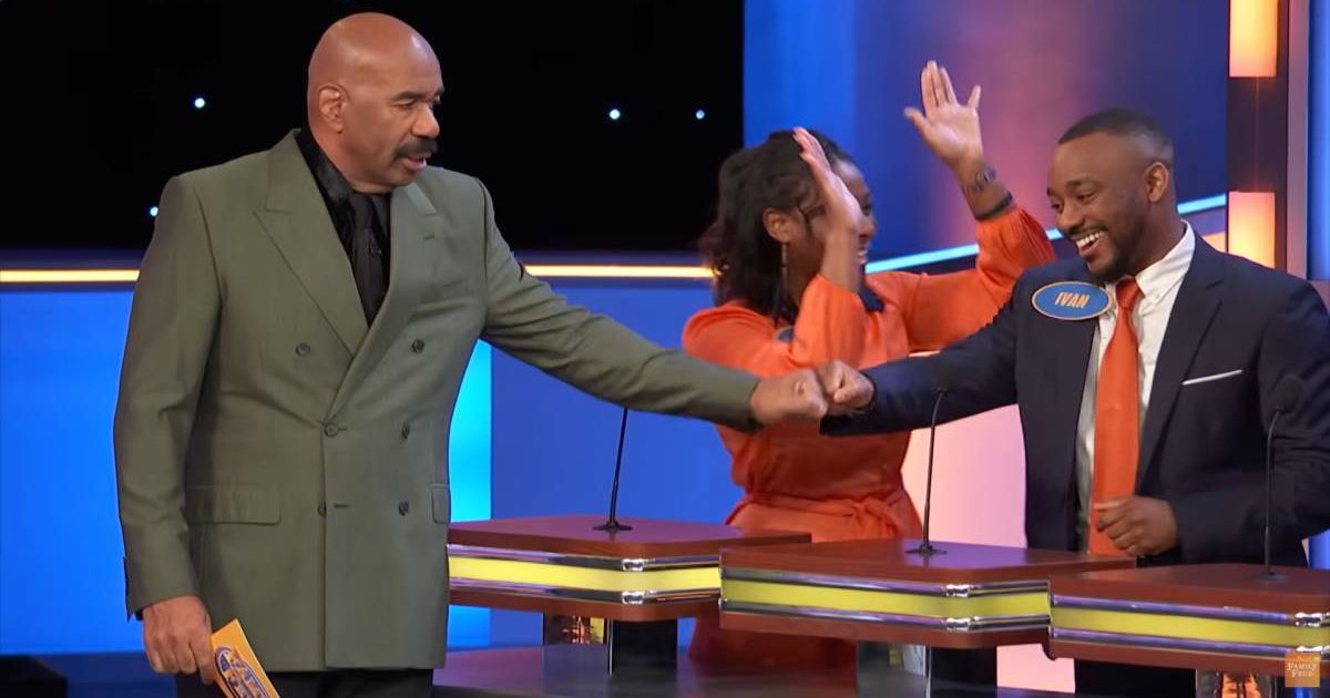 Screenshot showing Steve Harvey fist bumping a contestant (Cover image source: YouTube/Family Feud)