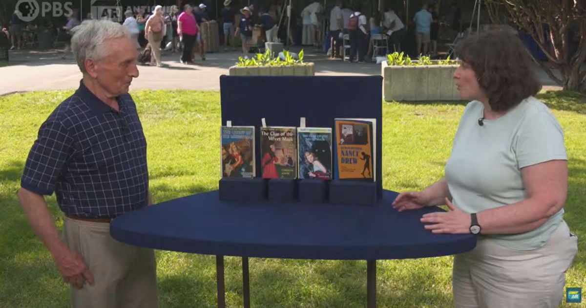 Screenshot showing the expert, the books, and the guest on the show (Cover image source: YouTube/Antiques Roadshow PBS)
