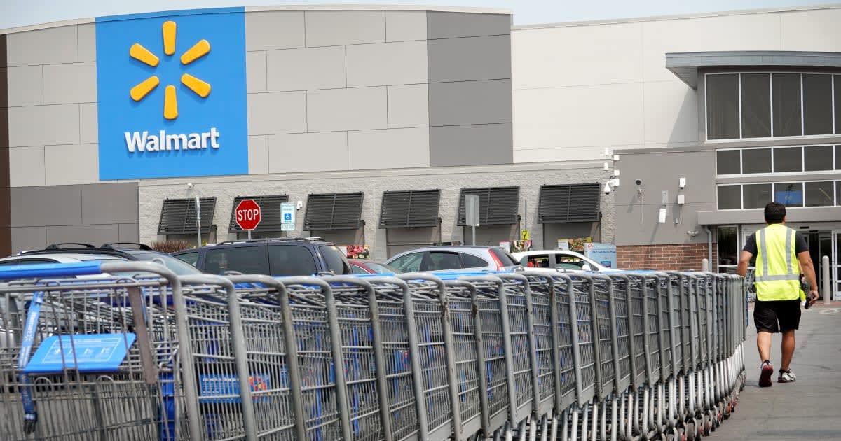  A worker collects shopping carts from the parking lot of a Walmart store on May 18, 2023 in Chicago, Illinois. Walmart, the world's largest retailer, today reported first-quarter same-store sales growth that beat expectations and the company raised its f