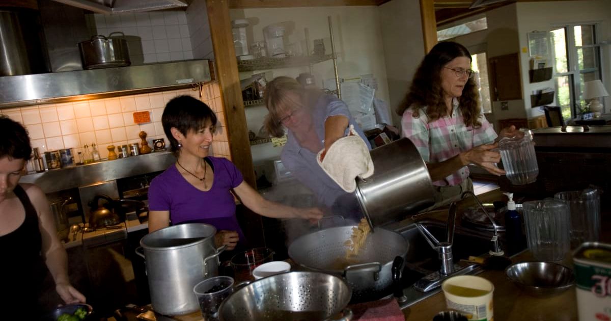 Representative image of a group of people cooking (Cover Image Source: Getty Images | Photo by Robert Nickelsberg)