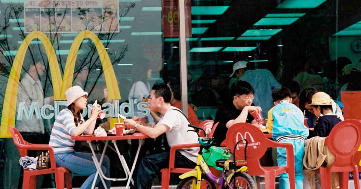 Customers having a meal at a McDonald's (Cover Image Source: Getty Images | Photo by John van Hasselt)