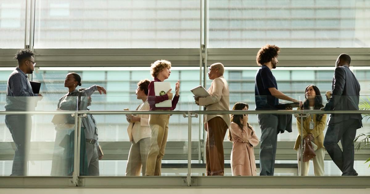 Representative image of workers outside an office (Cover image source: Getty Images/Klaus Vedfelt)