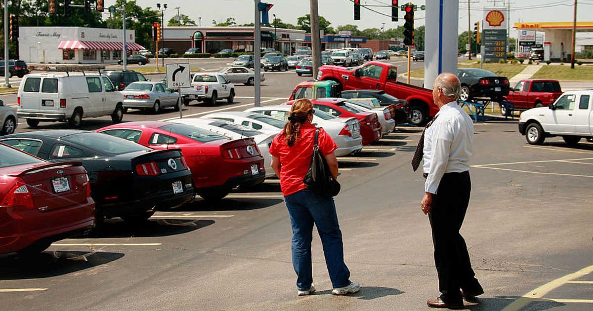 A customer at a car dealership (Cover Image Source: Getty Images | Photo by Scott Olson) 