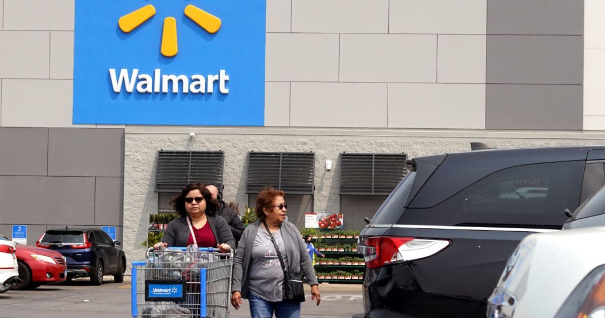 Shoppers exit a Walmart store. (Cover Image Source: Getty Images | Photo By Scott Olson)
