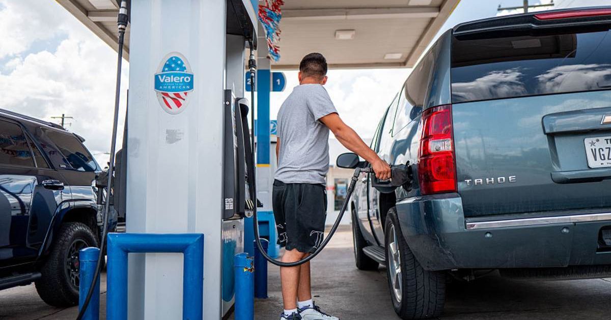 Representative image of a person pumping gas at a Valero gas station in Austin, Texas (Cover image source: Getty Images/Photo by Brandon Bell)