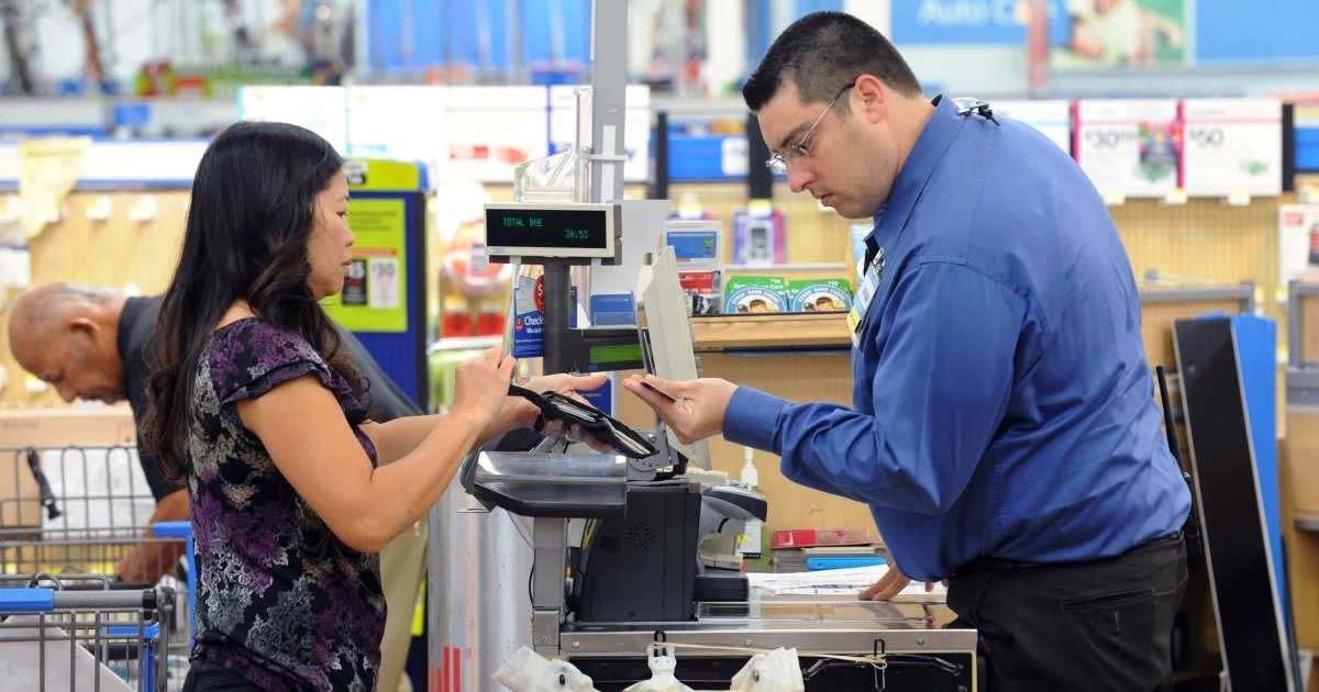 Representative image of a Walmart shopper at checkout. (Cover image Source: Getty Images | Photo by Bob Riha, Jr.)