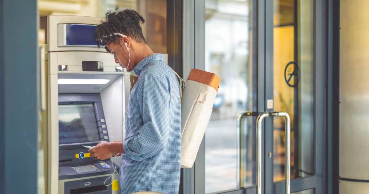 Representative image of a man at an ATM machine (Cover image source: Getty Images | Eva-Katalin)