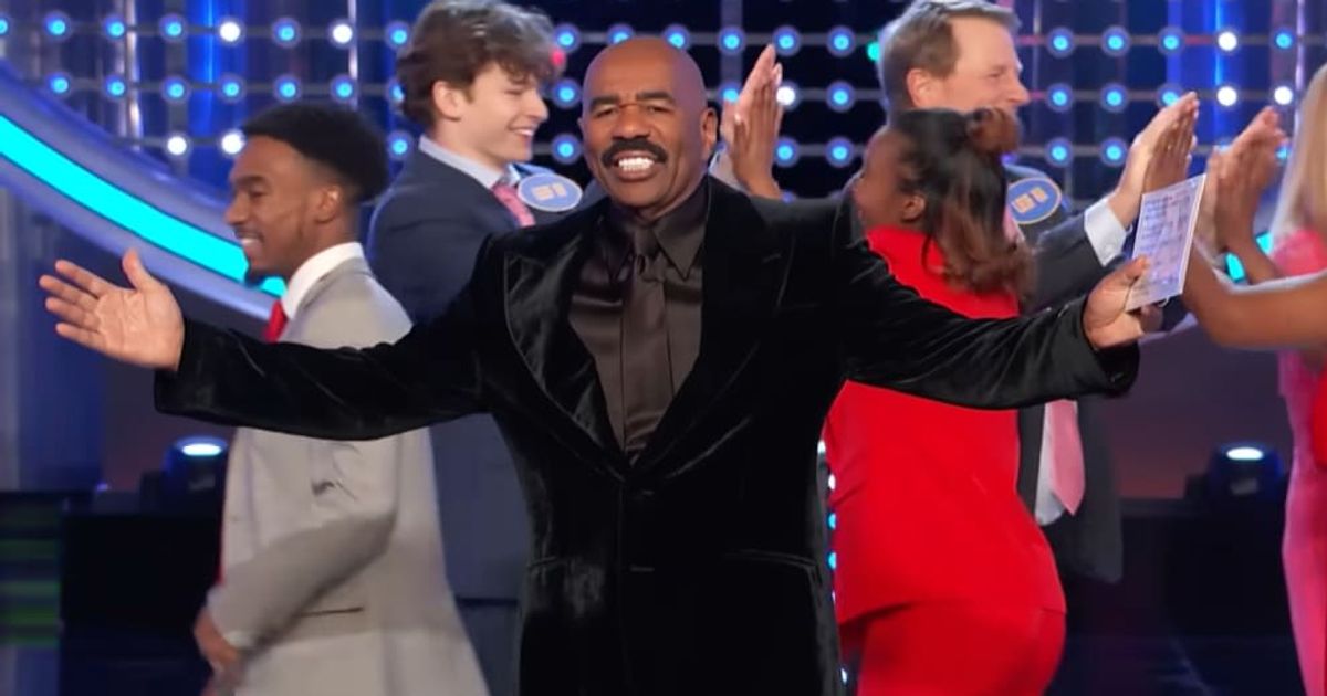 Screenshot showing Steve Harvey celebrating the win with the family (Cover image source: YouTube/Family Feud)