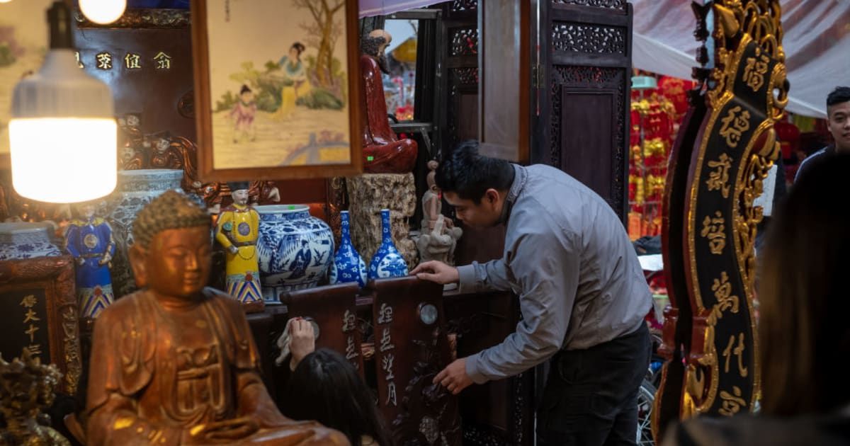 Representational image of a man examining antiques at a shop (Cover image source: Getty Images | Linh Pham)