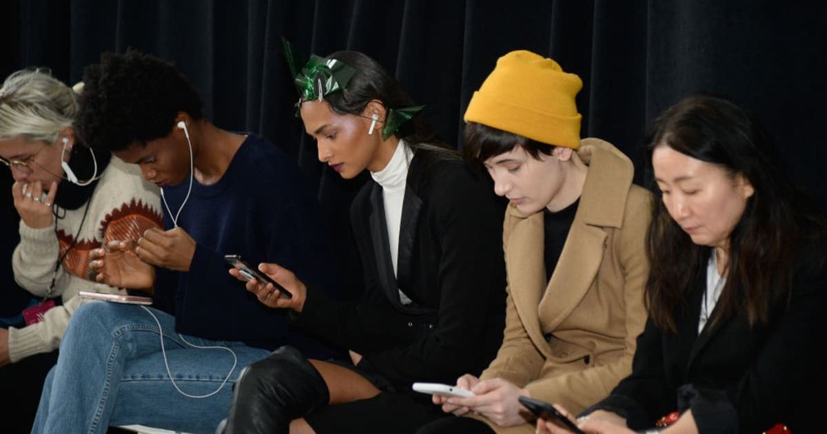 Representative image of people on their phones. (Cover Image Source: Getty Images | Photo by Fernanda Calfat)