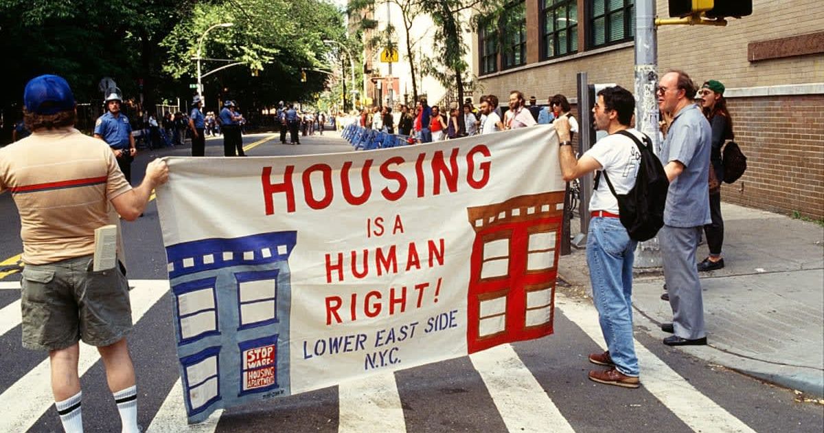 Representative image of Protestors during a demonstration demanding affordable housing (Cover image source: Getty Images/Photo by ANDREW HOLBROOKE)
