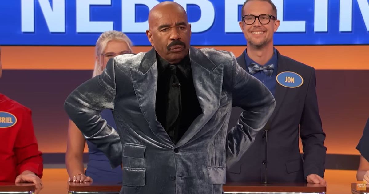 Screenshot showing Steve Harvey mimicking the player's posture (Cover image source: YouTube/Family Feud)