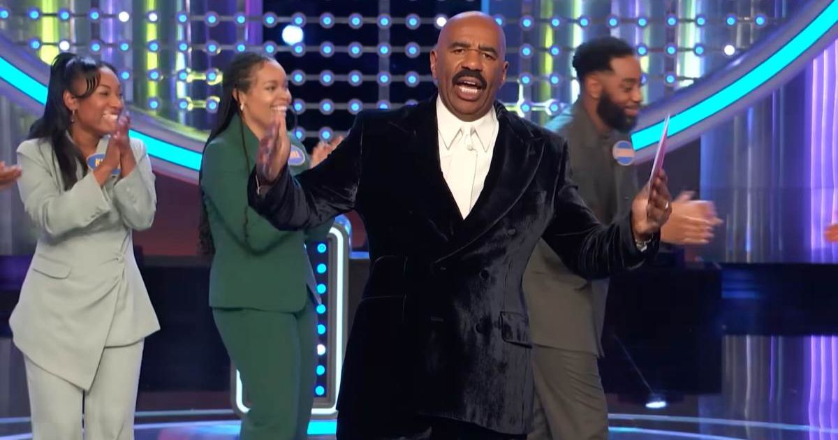 Screenshot showing Steve Harvey announcing the win and the contestants celebrating behind him (Cover image source: YouTube/Family Feud)
