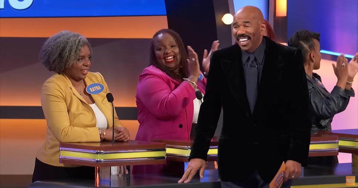 Screenshot showing Harvey laughing at one of the answers (Cover image source: YouTube/Family Feud)