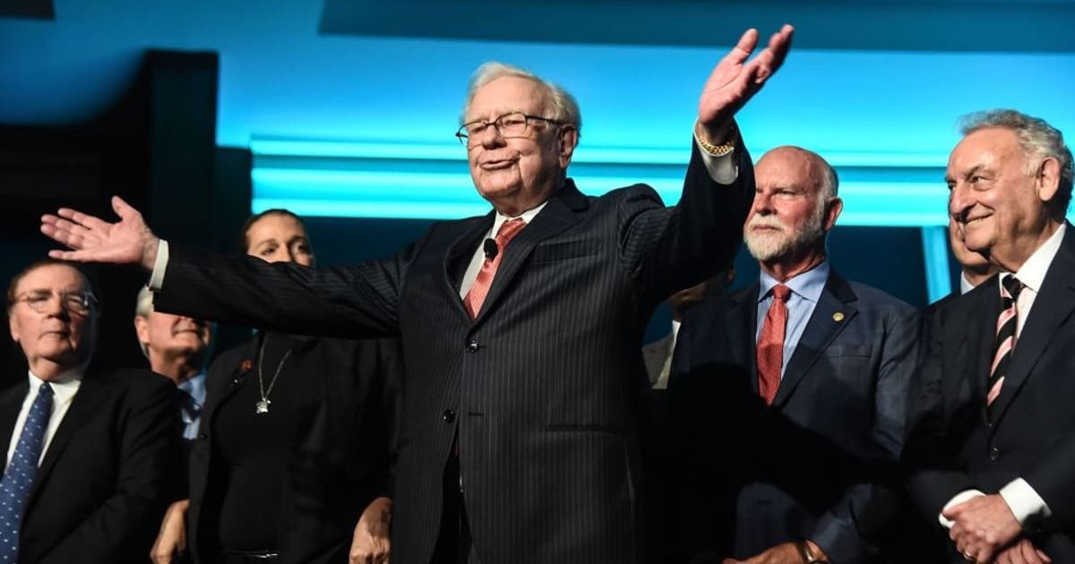 Warren Buffett with others on stage | Getty Images | Photo by Daniel Zuchnik
