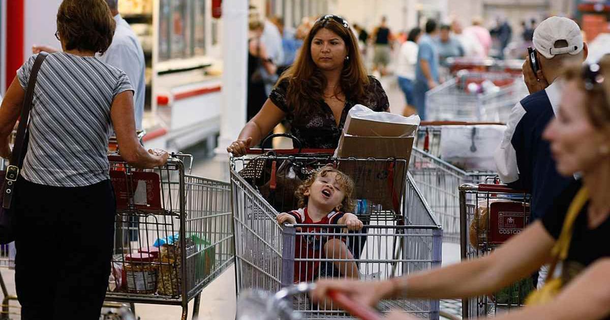 Costco shopper with baby. Photo by Joe Raedle/Getty Images